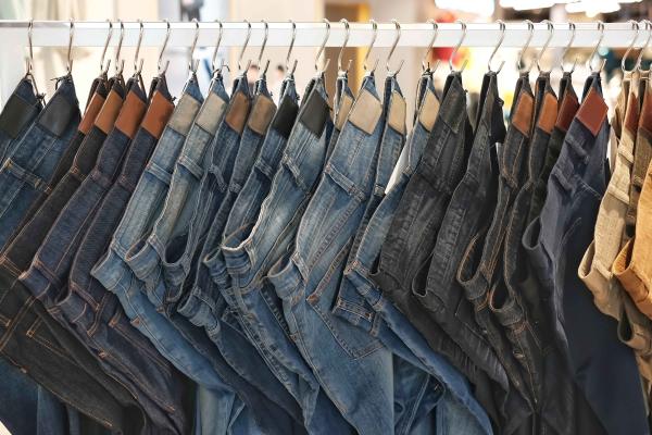 Jeans hanging on a rack