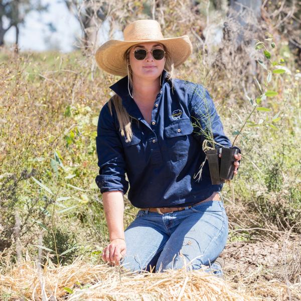 CRDC's Elsie Hudson planting a tree
